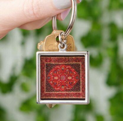 Red Persian Rug Mashhad Keychain in Hand